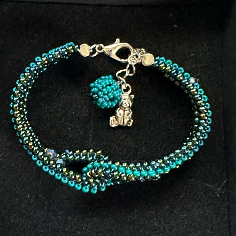 Elegant Beaded Bracelet with Charm